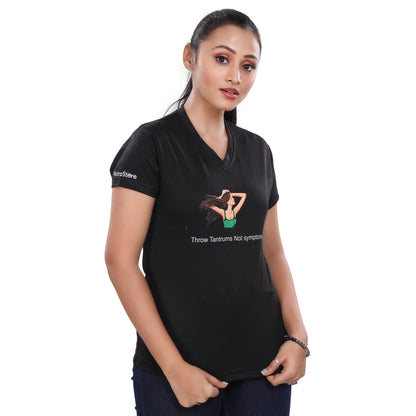 A woman wearing a NutraStore natural supplement brand black t-shirt with a graphic print in the center, running and holding a basketball.