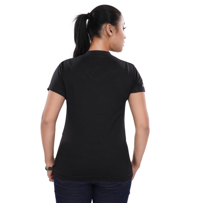A woman wearing a NutraStore natural supplement brand black t-shirt with a graphic print in the center, running and holding a basketball.