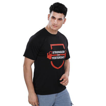 A man wearing a NutraStore natural supplement brand black t-shirt with a graphic print in the center, running and holding a basketball.