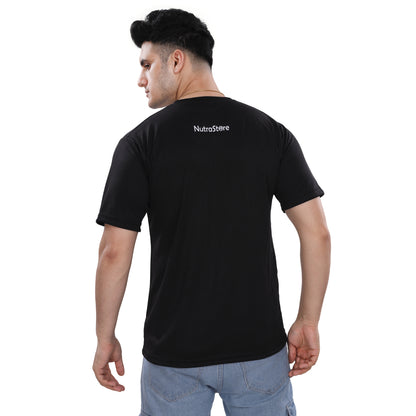 A man wearing a NutraStore natural supplement brand black t-shirt with a graphic print in the center, running and holding a basketball.